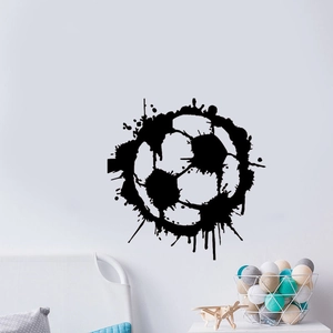 Artistic black splatter soccer wall sticker in a minimalist bedroom decor setting