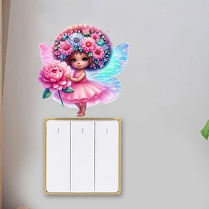 Detail view of butterfly fairy wall sticker with flower crown placed over a light switch