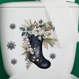 Detail of Christmas stocking wall sticker with poinsettia and snowflakes on white ceramic