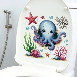 Détail d'un autocollant pieuvre bleue et étoiles de mer sur un couvercle de toilette