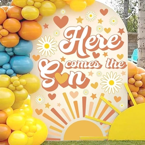 Detail of arch party backdrop with Here comes the Son quote and daisy flower decorations