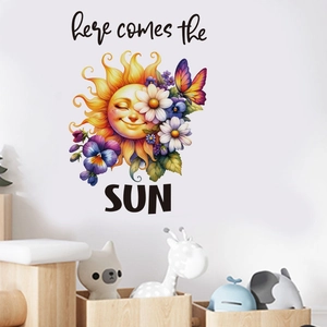 Detail of cartoon sunflower wall decal with 'here comes the SUN' text on white wall