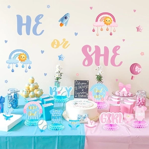 Gender reveal party setup with blue and pink honeycomb centerpieces and wall decals