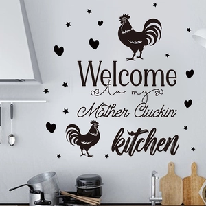 Detail showing 'Mother Cluckin' Kitchen' PVC wall decal with roosters and stars