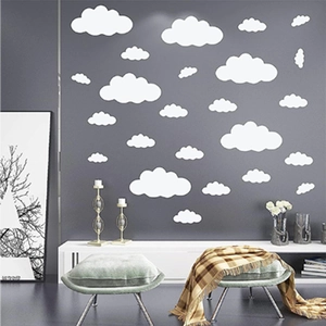 White cloud wall stickers for children's rooms in various sizes on dark grey background