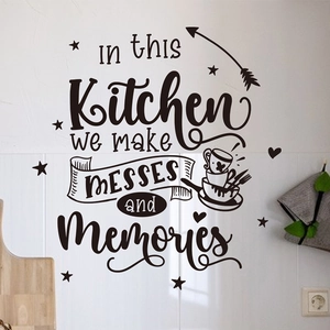 Detail of In this Kitchen we make Messes and Memories vinyl wall sticker on striped wall