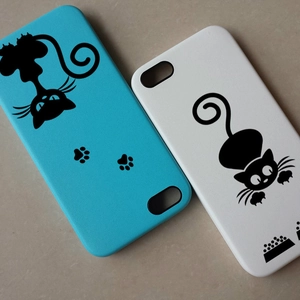 Detailed view of sky blue and ivory phone cases featuring black cartoon cat silhouettes