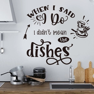 Macro detail of black vinyl kitchen wall decal featuring humorous text and icons