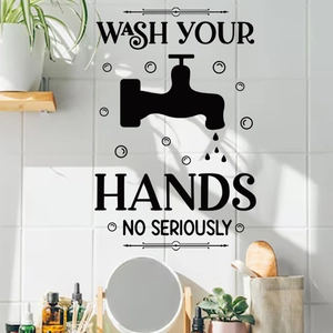 Detail von schwarzem Badezimmer-Wandsticker mit Wash Your Hands Text und Wasserhahn