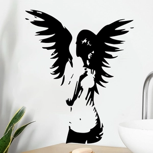 Detailed wall decal of a winged girl silhouette on a clean white bathroom wall