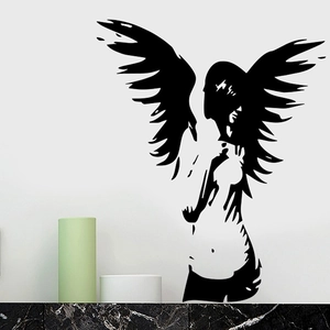 Close-up of black winged angel silhouette wall sticker in modern minimalist home decor style