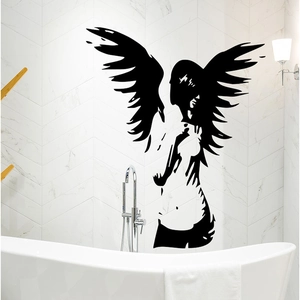 Modern black wing girl wall sticker silhouette displayed in a minimalist bathroom setting