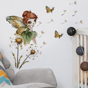 Detail view of fairy and dandelion wall decals on a white bedroom wall with soft lighting
