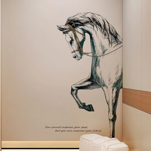 Detail of artistic horse sketch wall decal with inspirational text on a beige wall