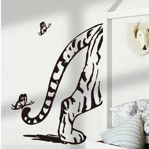 Detail of tiger tail wall sticker with butterflies in black silhouette home decor