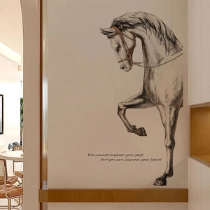 Sketch style horse wall decal with inspirational quote on a modern living room wall