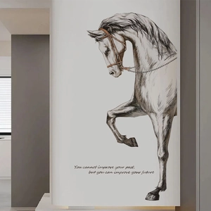 Detail of artistic horse sketch wall sticker with motivational quote on a grey wall