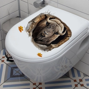 3D realistic bison sticker with autumn leaves applied to a white ceramic toilet cover