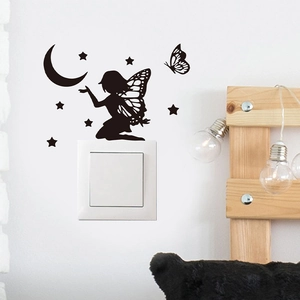Black fairy and butterfly silhouette wall sticker decorating a light switch panel