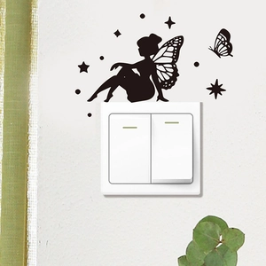 Detail of fairy silhouette and butterfly wall decals around a light switch