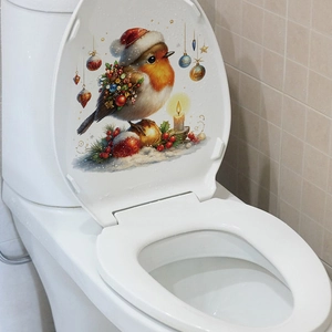 Detailed Christmas bird sticker with festive ornaments on a white ceramic toilet lid cover