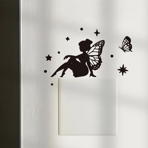Black silhouette wall sticker featuring fairy and butterflies for light switch decoration