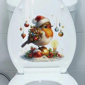 Detailed view of festive Christmas bird sticker with candle on a white toilet lid