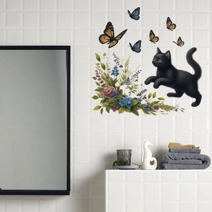 Detailed view of cartoon black cat and butterfly wall stickers on white tile bathroom walls