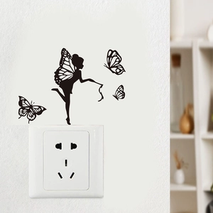 Detailed view of black fairy silhouette with butterflies wall decal on a light wall