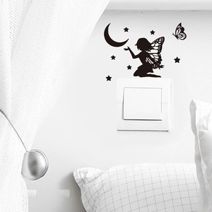 Black fairy silhouette wall sticker with moon stars and butterflies above light switch