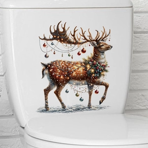 Détail de l'autocollant de renne de Noël étanche avec lumières sur un WC blanc