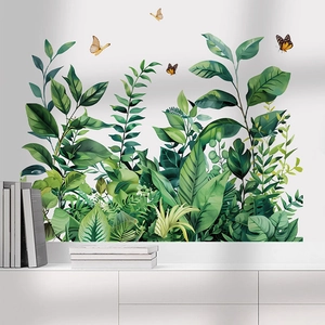 Tropical green leaf wall decals with butterflies for a modern living room decor