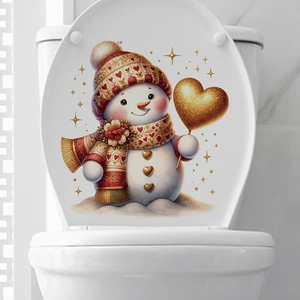 Close-up of cute cartoon snowman decal with golden heart balloon on white toilet lid