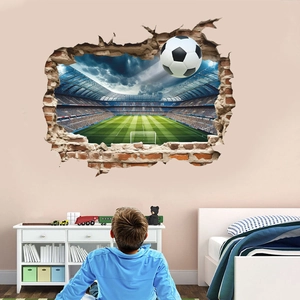 3D football wall decal showing a soccer ball breaking through wall in kids room