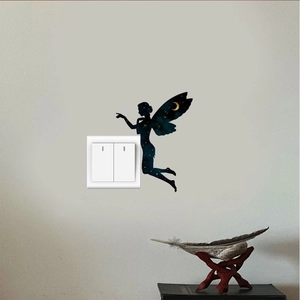 Detail of fairy silhouette wall sticker with starry night moon pattern near light switch