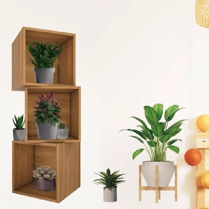 Three-tier wooden square modular shelving unit with plants and decorative string lights