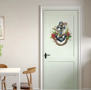 Détail d'un autocollant de porte nautique avec ancre, corde de chanvre et roses rouges