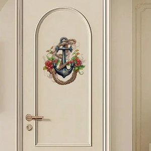 Sticker autocollant avec ancre et roses décorant une porte intérieure blanche