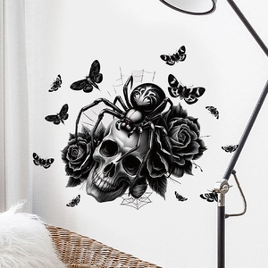 Gothic wall sticker detail with skull, black roses, spider and moths in a home setting