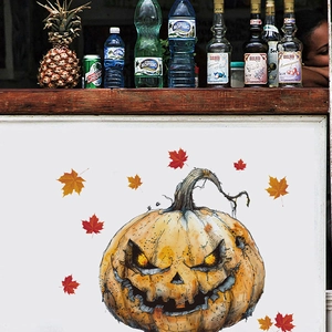 Detail view of spooky Halloween pumpkin wall sticker and autumn maple leaf decals