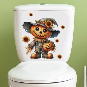 Detail of Halloween pumpkin scarecrow decal applied to a white ceramic toilet tank surface