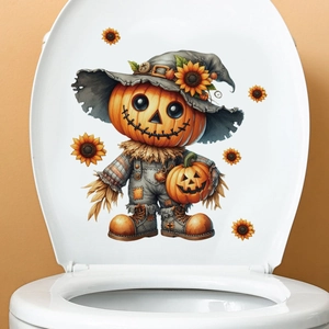 Close-up of Halloween pumpkin scarecrow decal applied to a white toilet lid surface