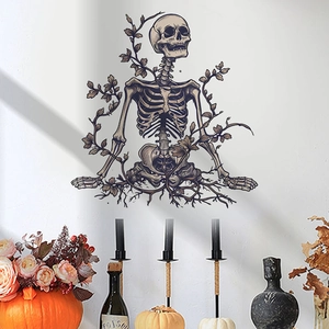 Detail of meditation skeleton wall sticker with intricate vine patterns on a white wall