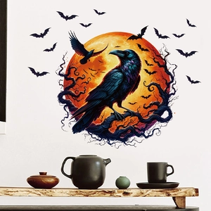 Detail of raven wall decal on orange moon with bats on white wall above shelf