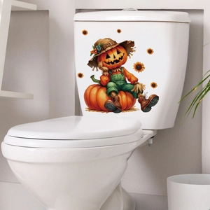 Detail of Halloween pumpkin scarecrow decal applied to a white ceramic toilet tank