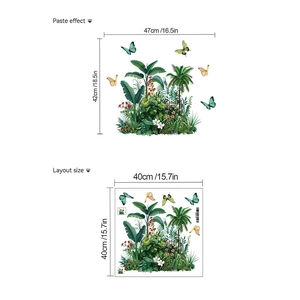 Detail view of tropical plant wall stickers with palm leaves and butterflies layout
