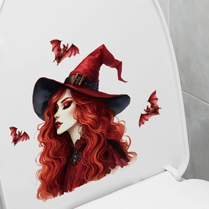 Detailed view of a Halloween witch and bats decal applied to a white toilet seat cover