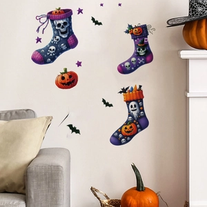 Halloween wall decals with skeleton, witch and pumpkin socks on a white living room wall