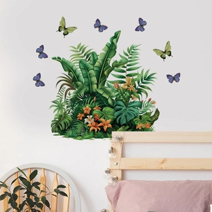 Bedroom scene showing tropical plant wall stickers with leaves, flowers and colorful butterflies