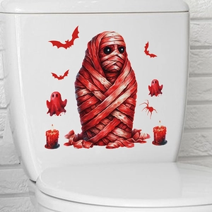 Macro detail of red mummy and ghost PVC stickers applied on a white surface
